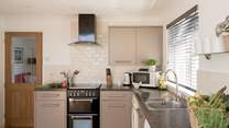 Prepare your beach picnic in the stylish kitchen.