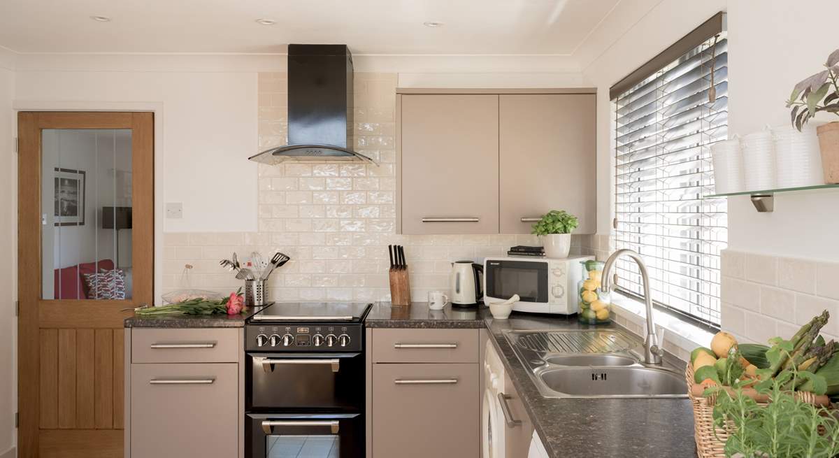 Prepare your beach picnic in the stylish kitchen.