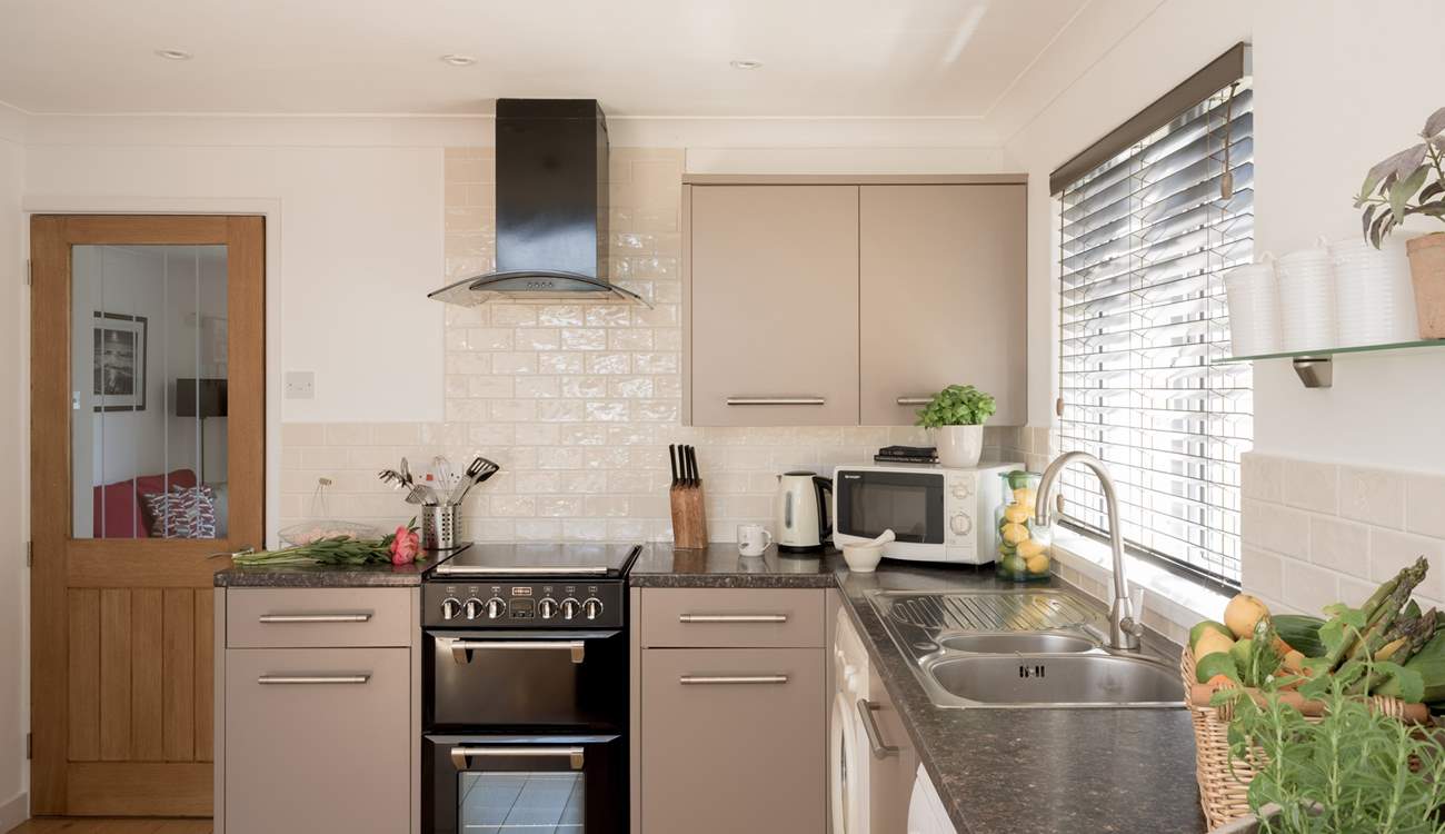 Prepare your beach picnic in the stylish kitchen.