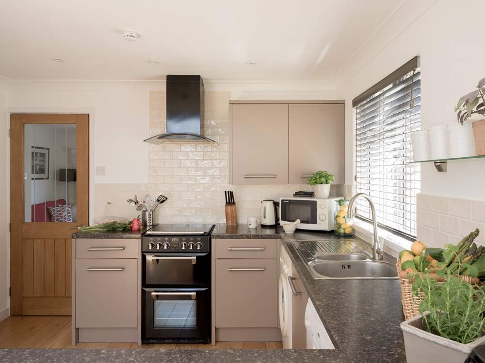 Prepare your beach picnic in the stylish kitchen.
