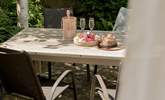 The tranquil outside space is perfect for alfresco dining.  - Thumbnail Image