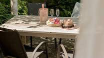 The tranquil outside space is perfect for al fresco dining. 