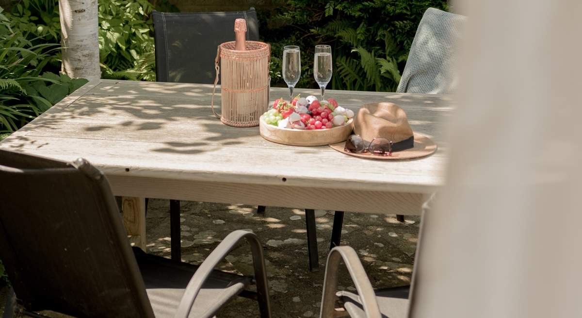 The tranquil outside space is perfect for alfresco dining. 