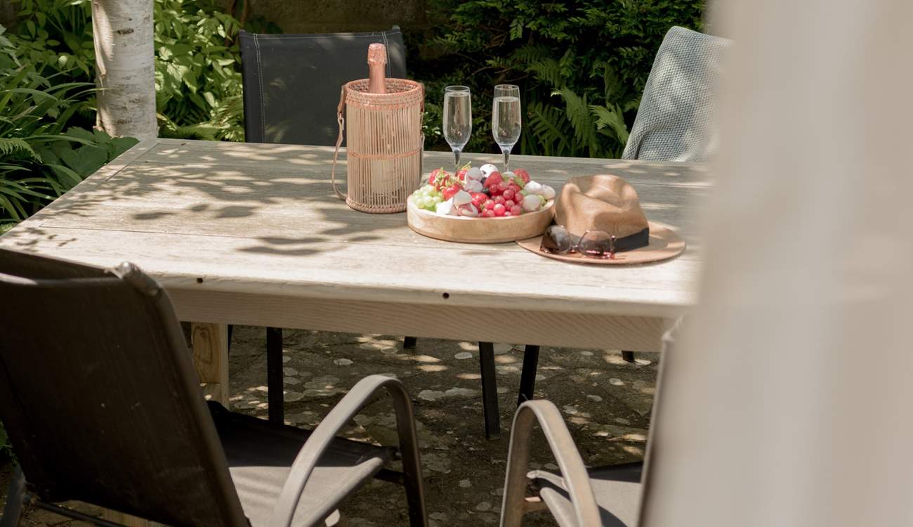 The tranquil outside space is perfect for al fresco dining. 