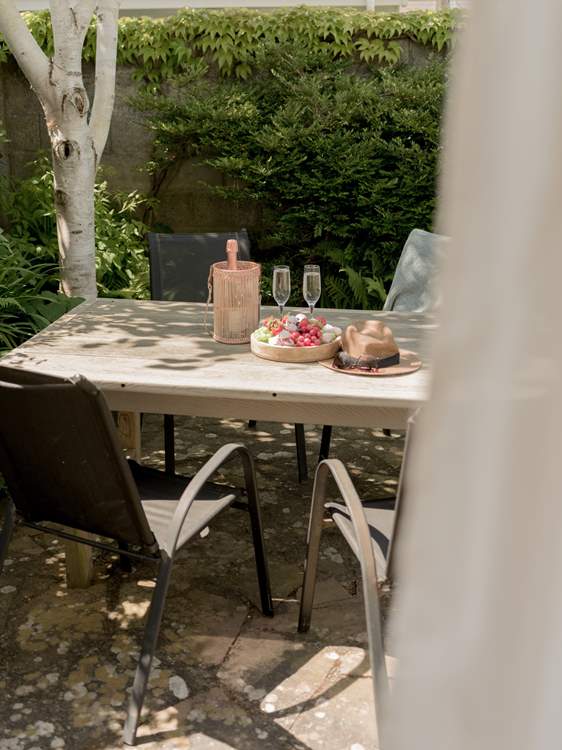 The tranquil outside space is perfect for alfresco dining.