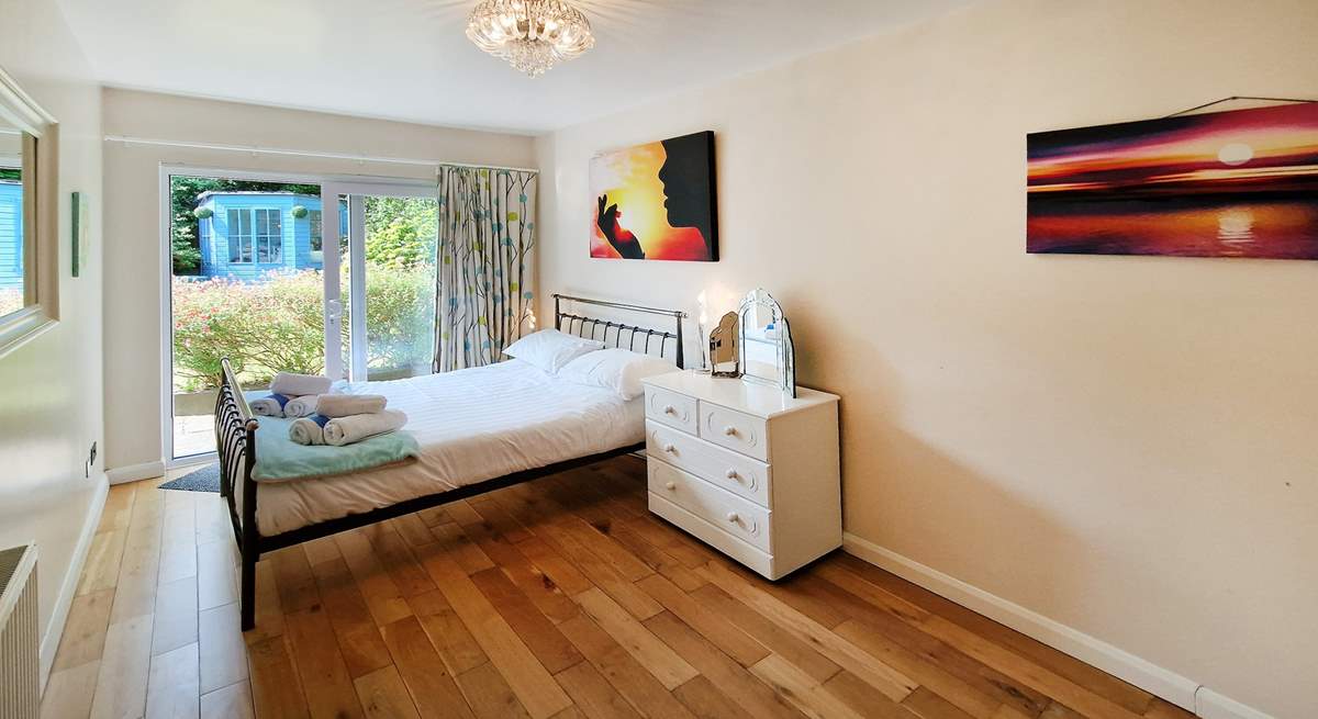Access into the pretty garden from this double bedroom. 