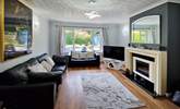 Relax in the comfortable sitting-room after a busy beach day. - Thumbnail Image