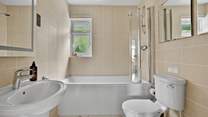 The family bathroom offers a bath or shower - perfect for rinsing sandy toes.