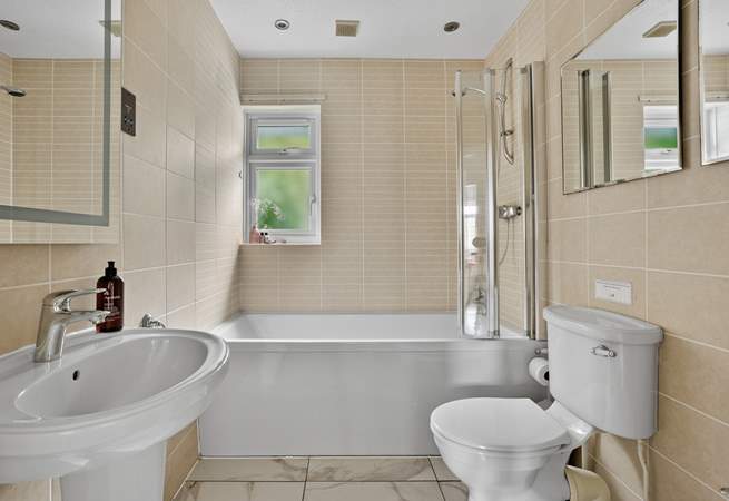 The family bathroom offers a bath or shower - perfect for rinsing sandy toes.