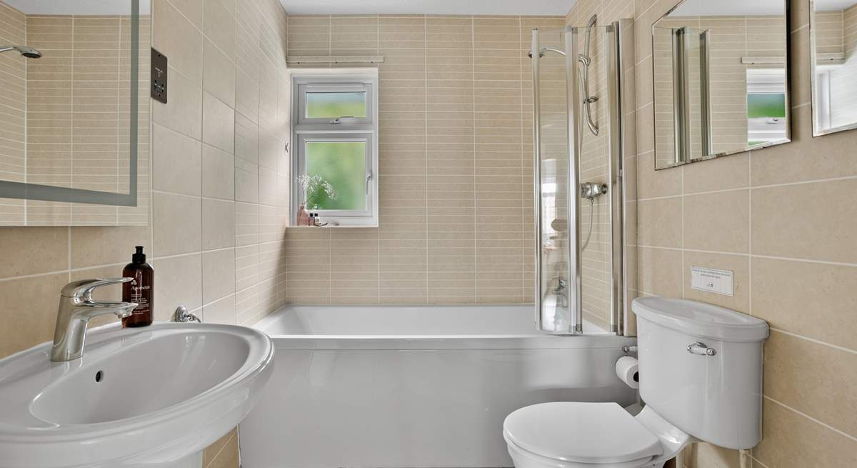 The family bathroom offers a bath or shower - perfect for rinsing sandy toes.