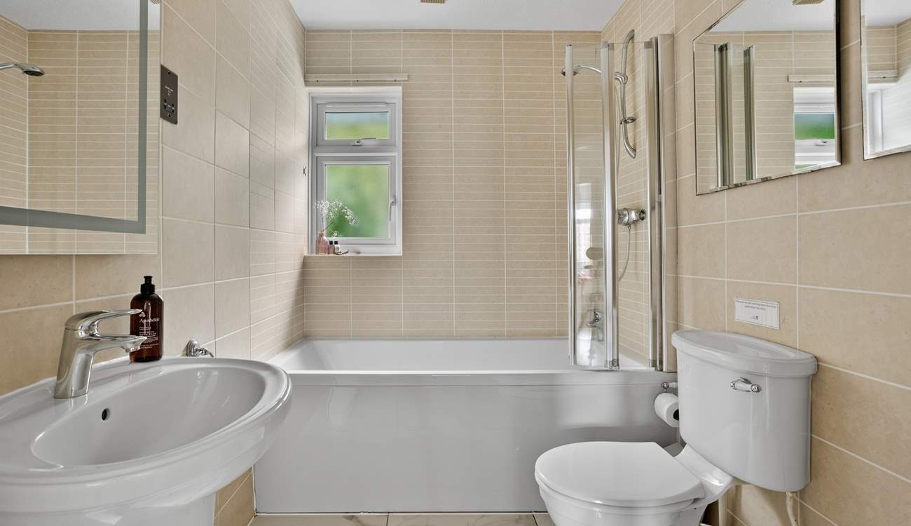 The family bathroom offers a bath or shower - perfect for rinsing sandy toes.