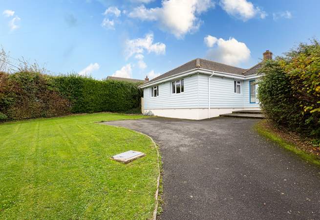 The driveway offers parking for up to 3 cars.