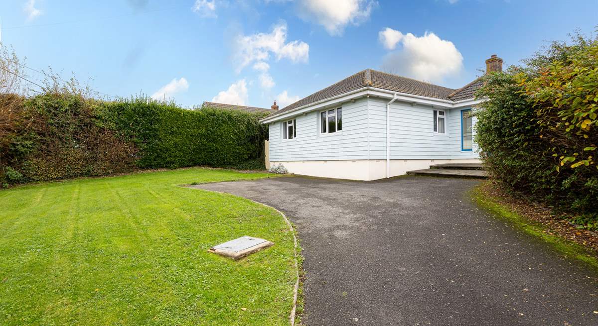 The driveway offers parking for up to 3 cars.