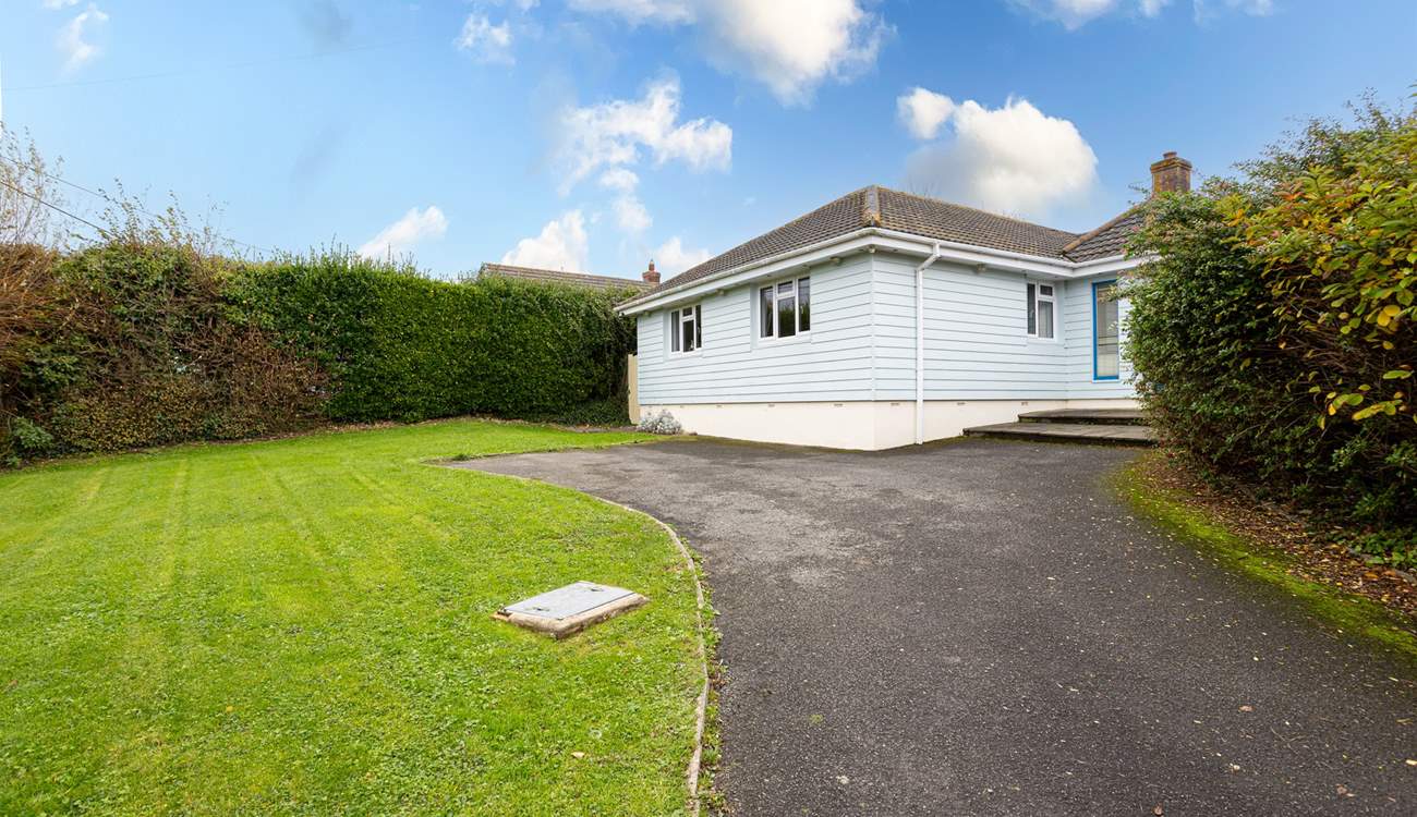 The driveway offers parking for up to 3 cars.
