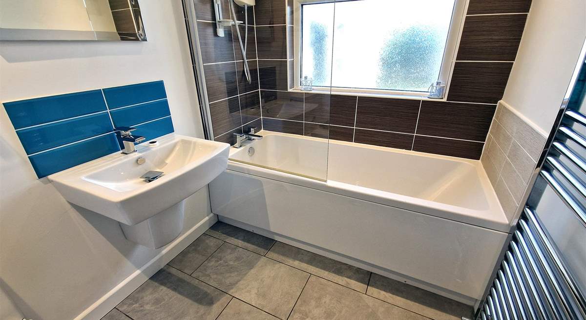 There is also a family bathroom with bath and shower over. 