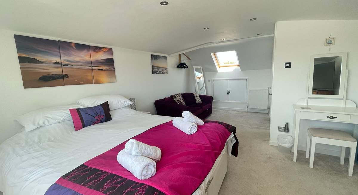 This spacious room also has an en suite shower-room. 