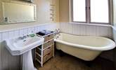 The family bathroom has a bath with hand-held shower.  - Thumbnail Image