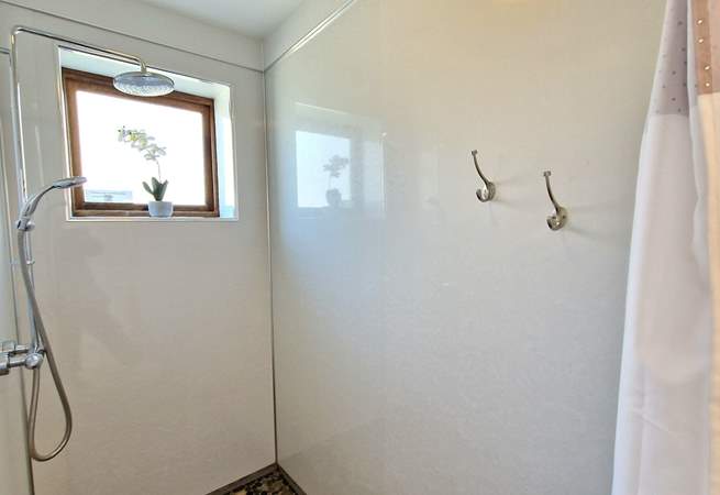 A handy wet-room is situated on the ground floor, perfect for rinsing salty toes.