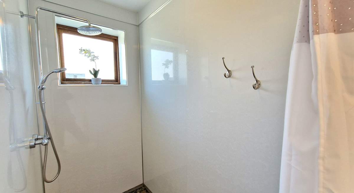 A handy wet-room is situated on the ground floor, perfect for rinsing salty toes.