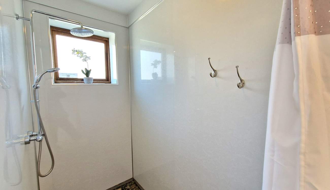 A handy wet-room is situated on the ground floor, perfect for rinsing salty toes.
