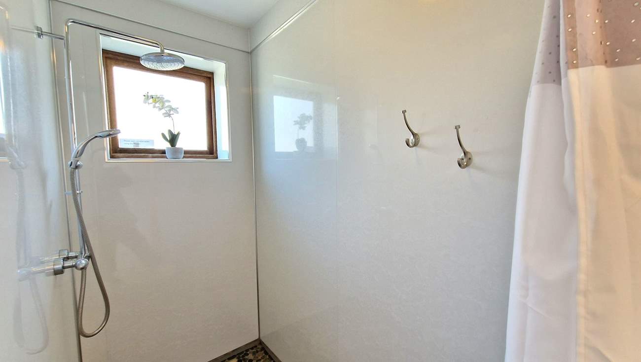 A handy wet-room is situated on the ground floor, perfect for rinsing salty toes.
