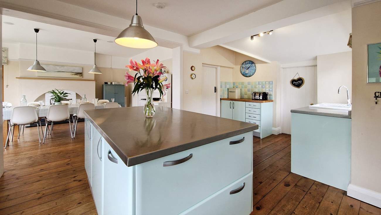 The kitchen is beautifully styled in pastel shades.