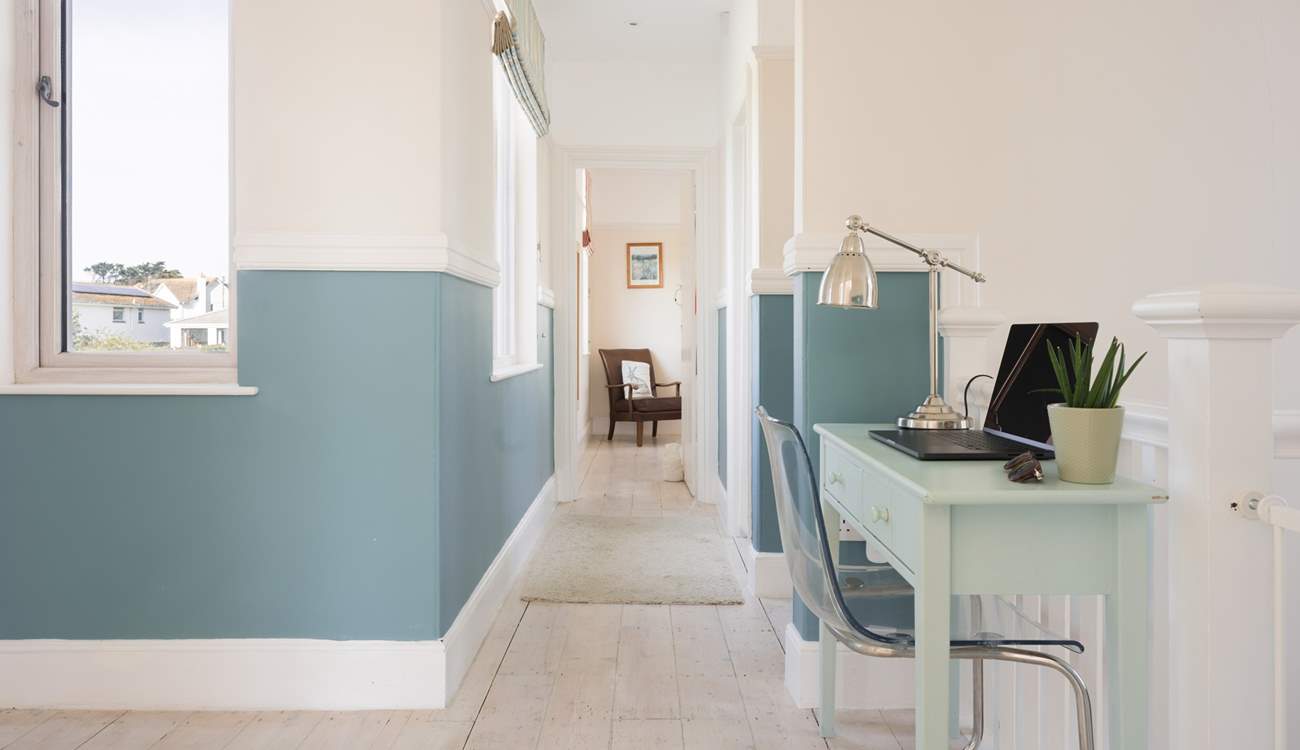 Head down the hall passing the family bathroom.