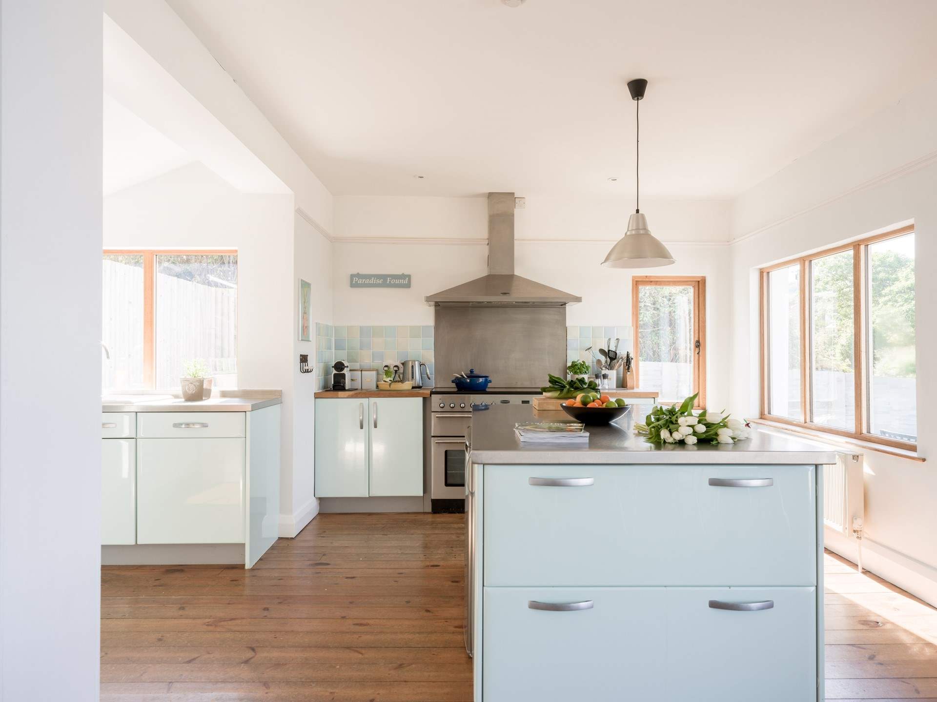 The kitchen is fully equipped and floods with light.