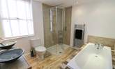 The family bathroom on the ground floor has a bath and separate shower cubicle.  - Thumbnail Image