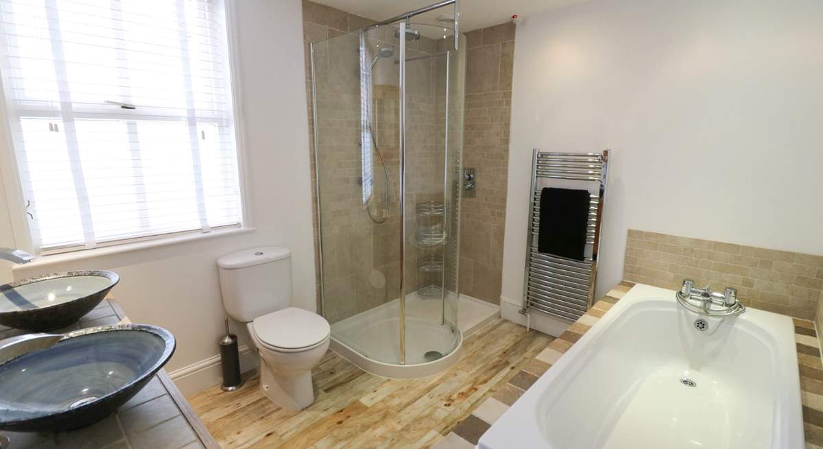 The family bathroom on the ground floor has a bath and separate shower cubicle. 