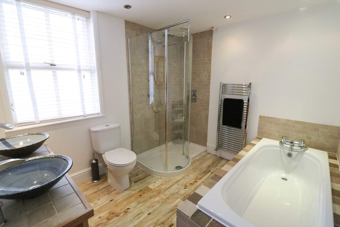 The family bathroom on the ground floor has a bath and separate shower cubicle.