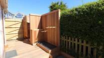 Outside you will find cleverly crafted space for surf boards, wet suits and a shower. 