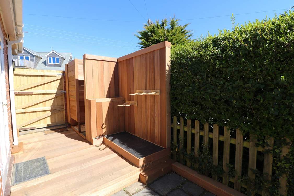 Outside you will find cleverly crafted space for surf boards, wet suits and a shower.