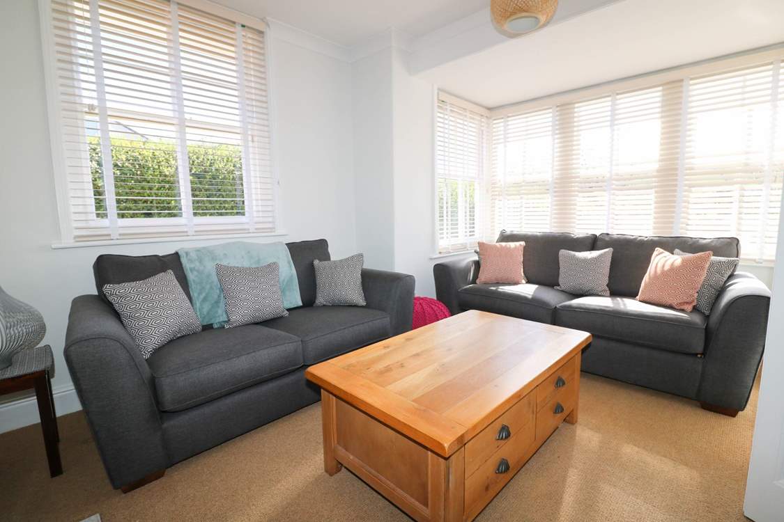 The dual-aspect sitting-room is light and inviting.