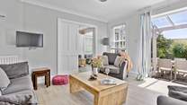 Comfy sofas await in the sitting-room. 
