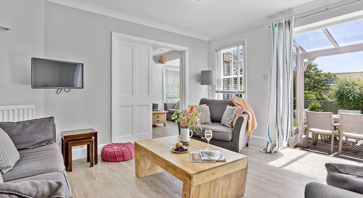 Comfy sofas await in the sitting-room. 