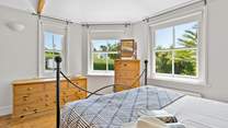 Triple aspect windows let the light flood into this gorgeous bedroom on the ground floor. 