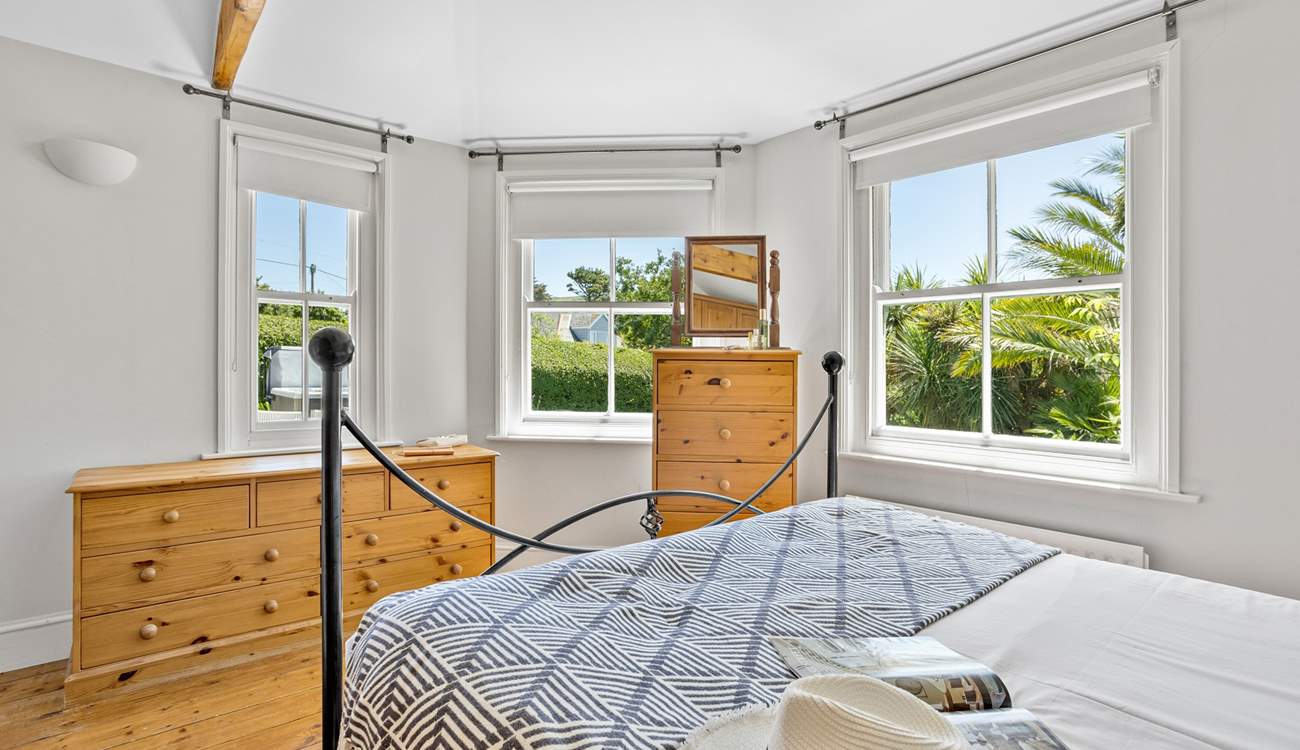 Triple aspect windows let the light flood into this gorgeous bedroom on the ground floor. 