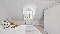 Charming bedrooms await. 