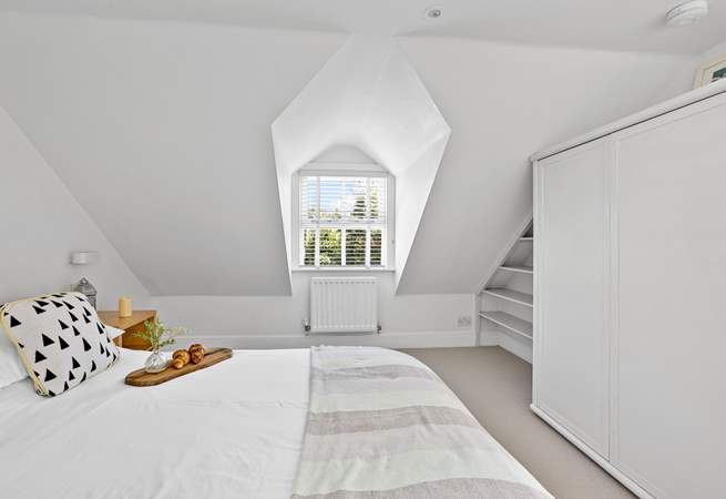 Charming bedrooms await. 