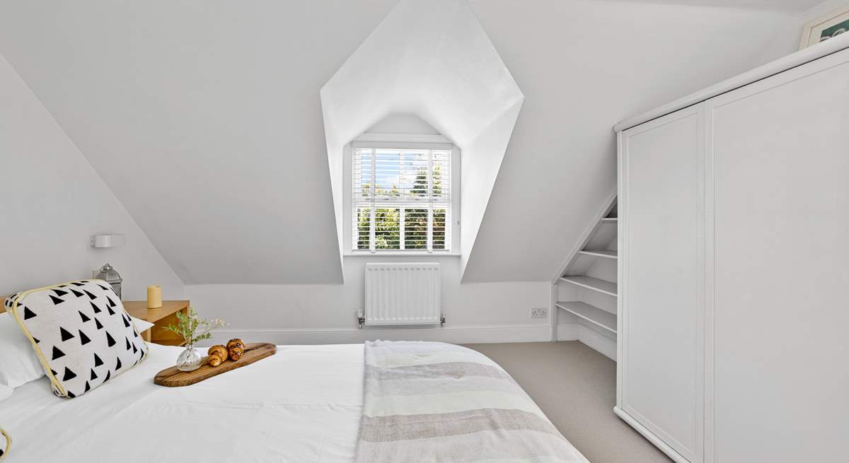 Charming bedrooms await. 