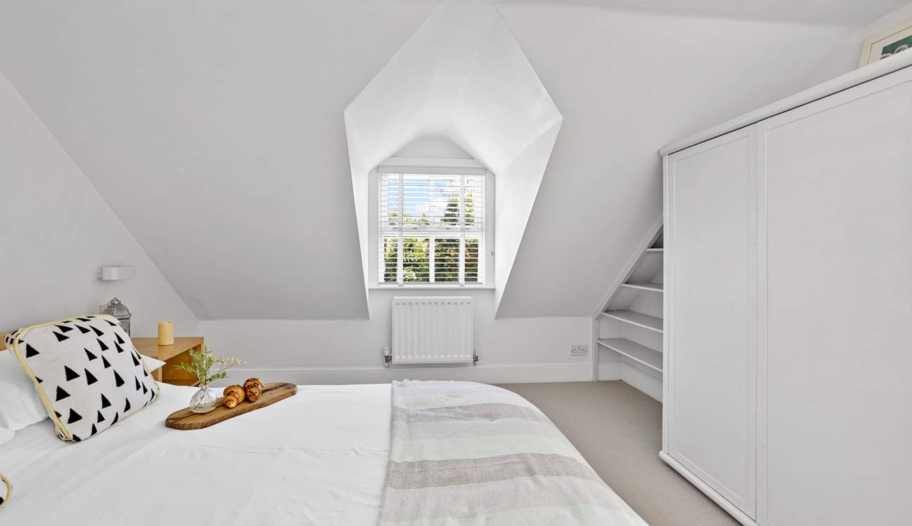 Charming bedrooms await. 