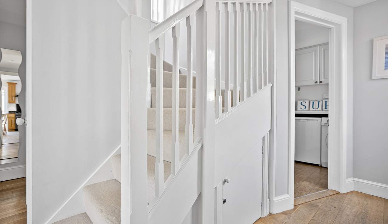 Stairs lead to the first floor bedrooms. 
