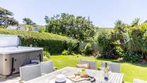 The enclosed garden is perfect for al fresco dining. 