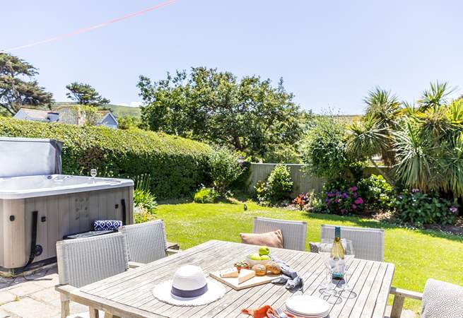 The enclosed garden is perfect for al fresco dining. 