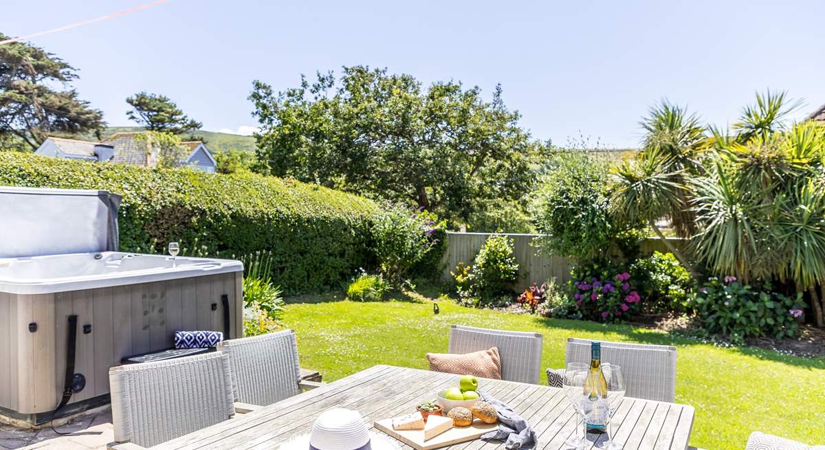The enclosed garden is perfect for al fresco dining. 