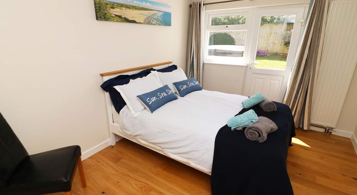 A double bedroom with access to the garden. 