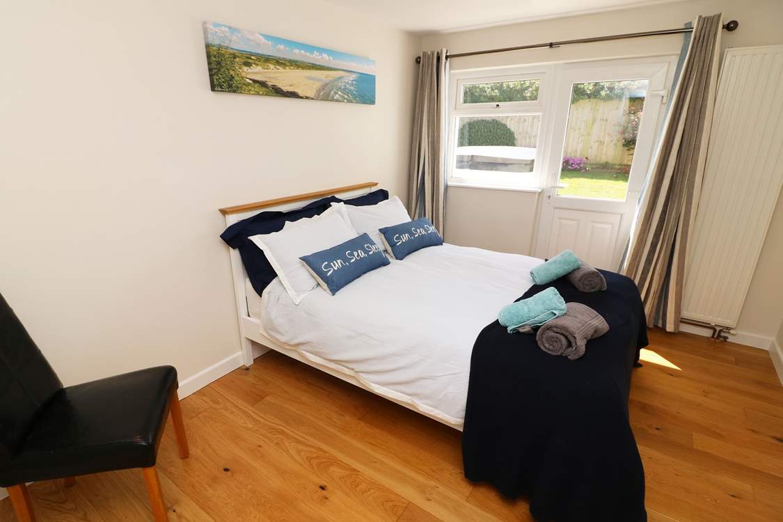 A double bedroom with access to the garden.