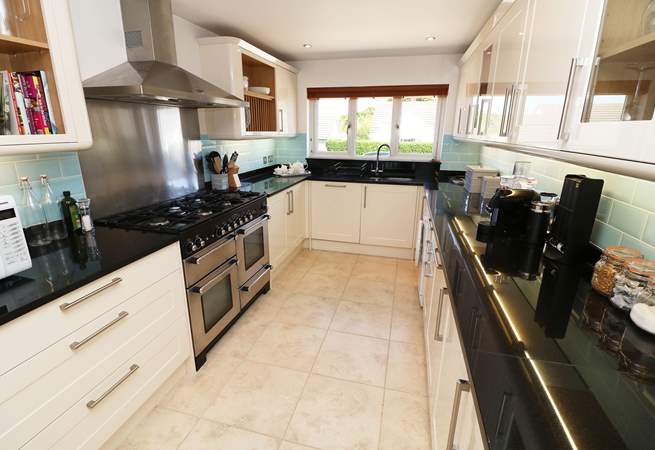 The impressive kitchen has all the equipment you will need. 