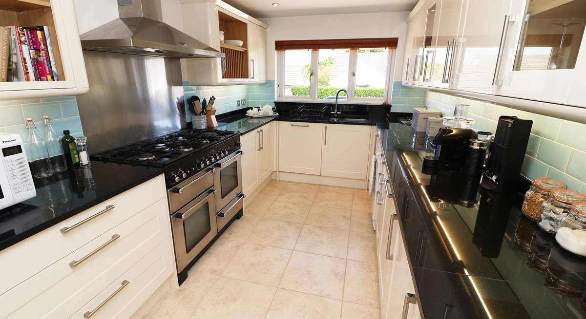 The impressive kitchen has all the equipment you will need. 